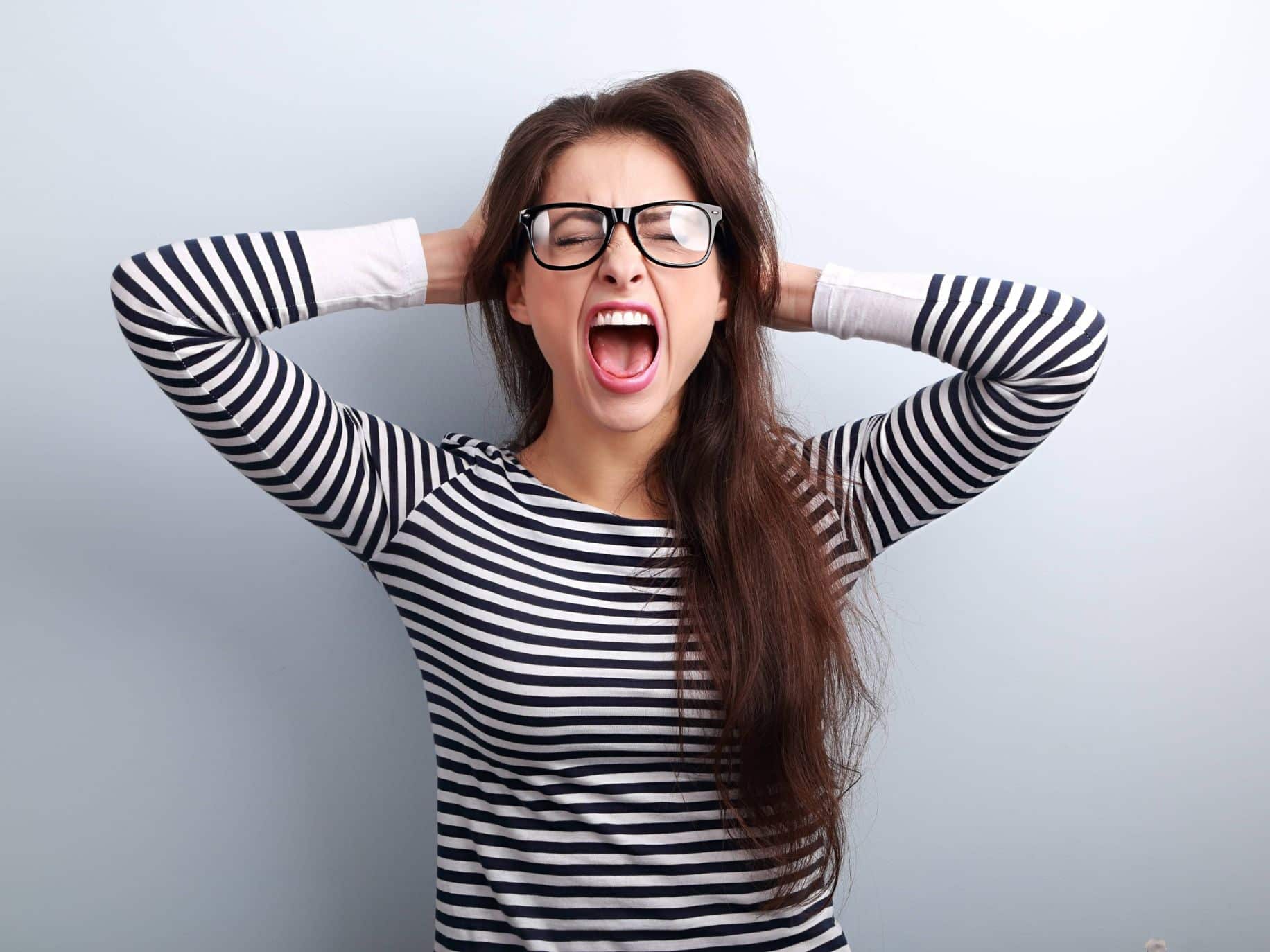 Woman in glasses frustrated and angry