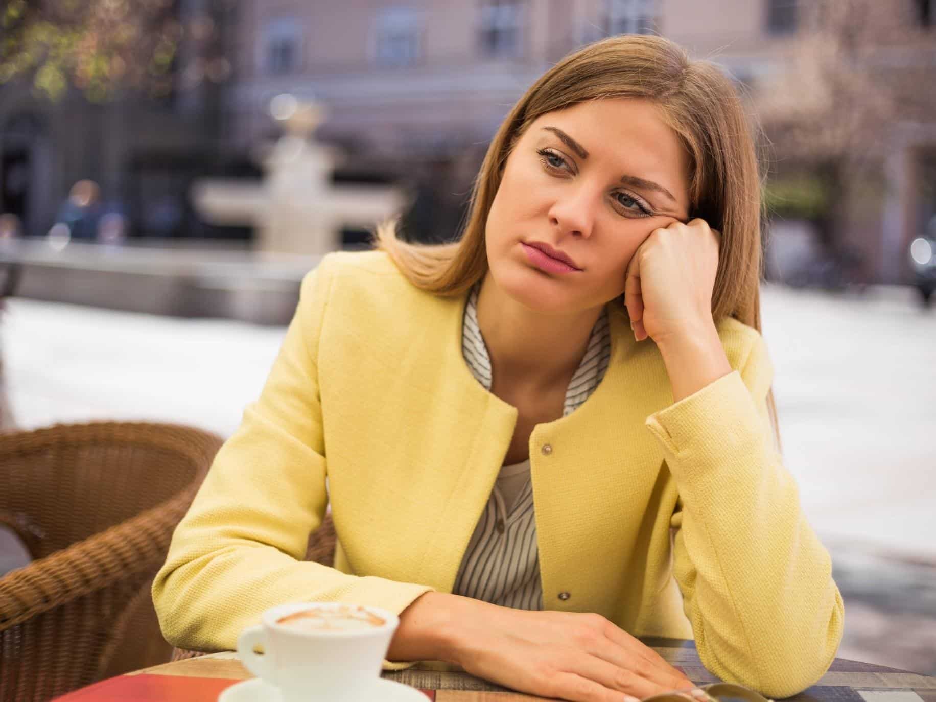 caffeine and anxiety - woman sabotaging her happiness by drinking caffeine