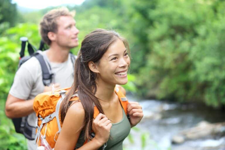 Denver Therapist: Woman and man hiking near river