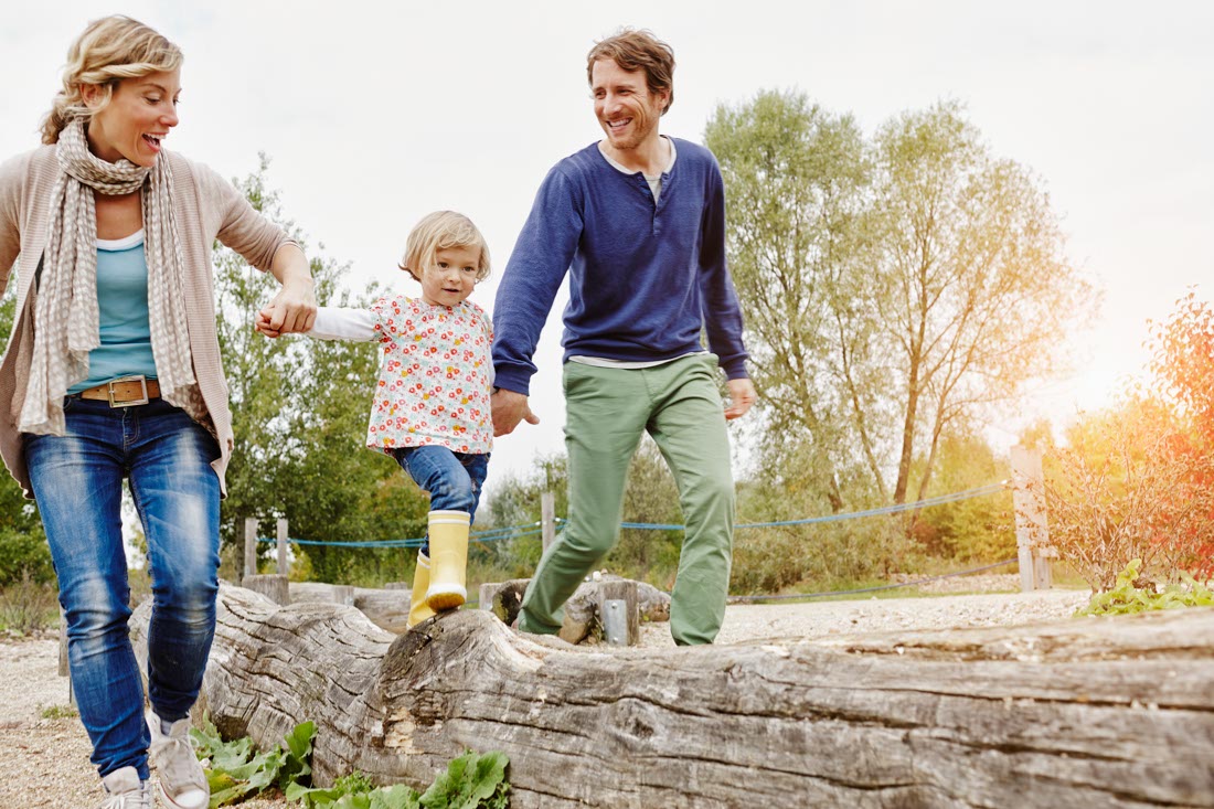 Colorado couple walking with daughter, representing Denver marriage counseling 