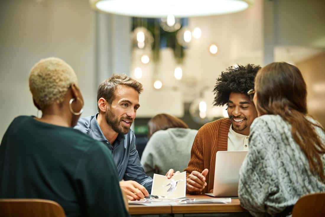 Group meeting around table: success at work requires emotional intelligence