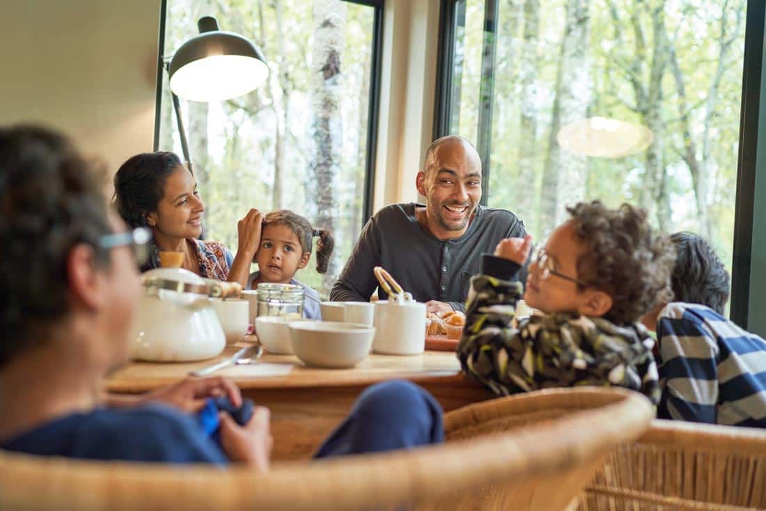 Family at breakfast table, representing Parenting Coaching and Family Therapy Build Connection