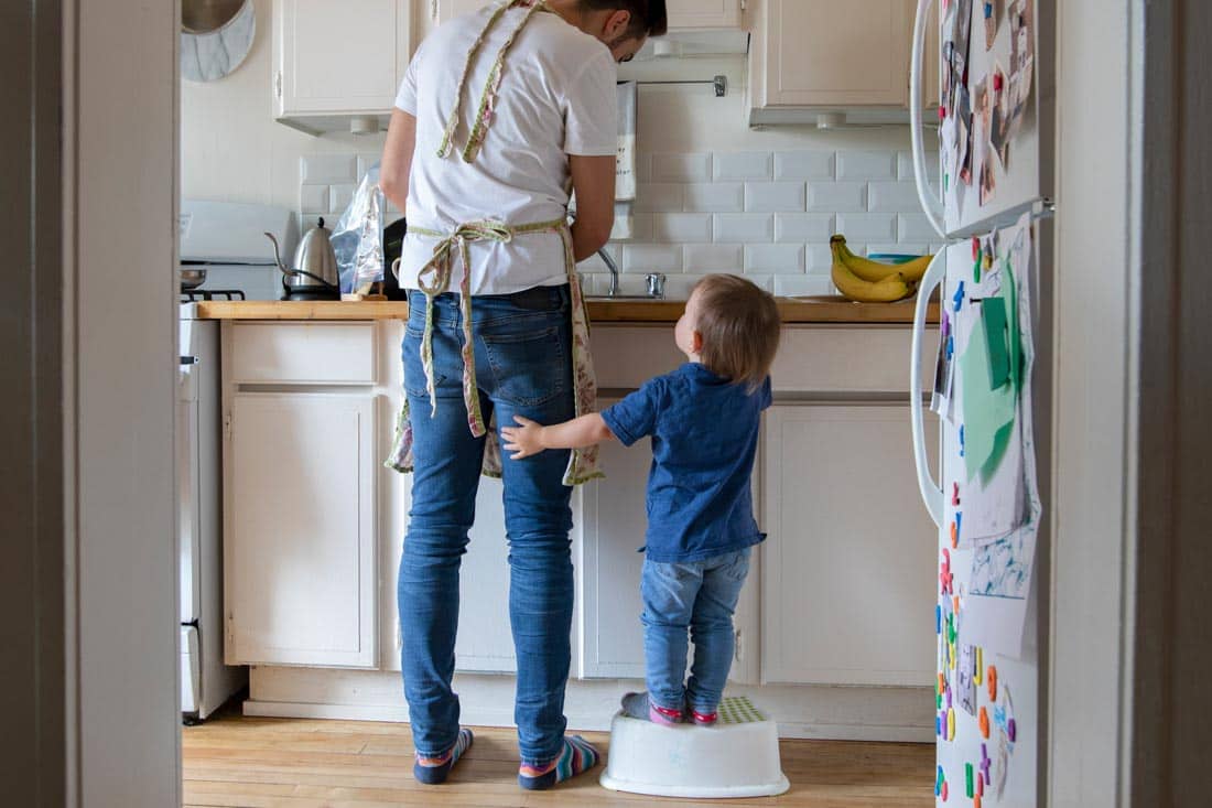 Father and child in kitchen, representing how Parenting Coaching and Family Therapy Cultivate Growth