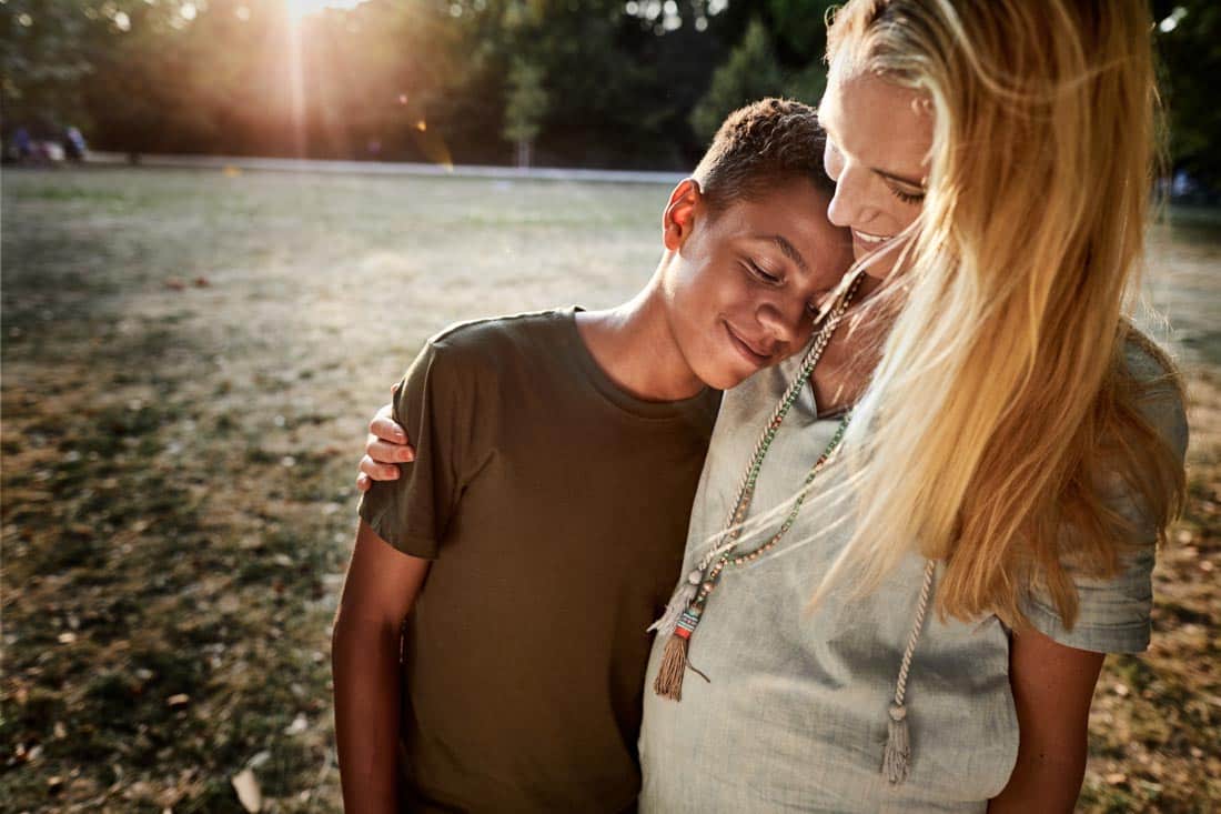 Mother and son hugging