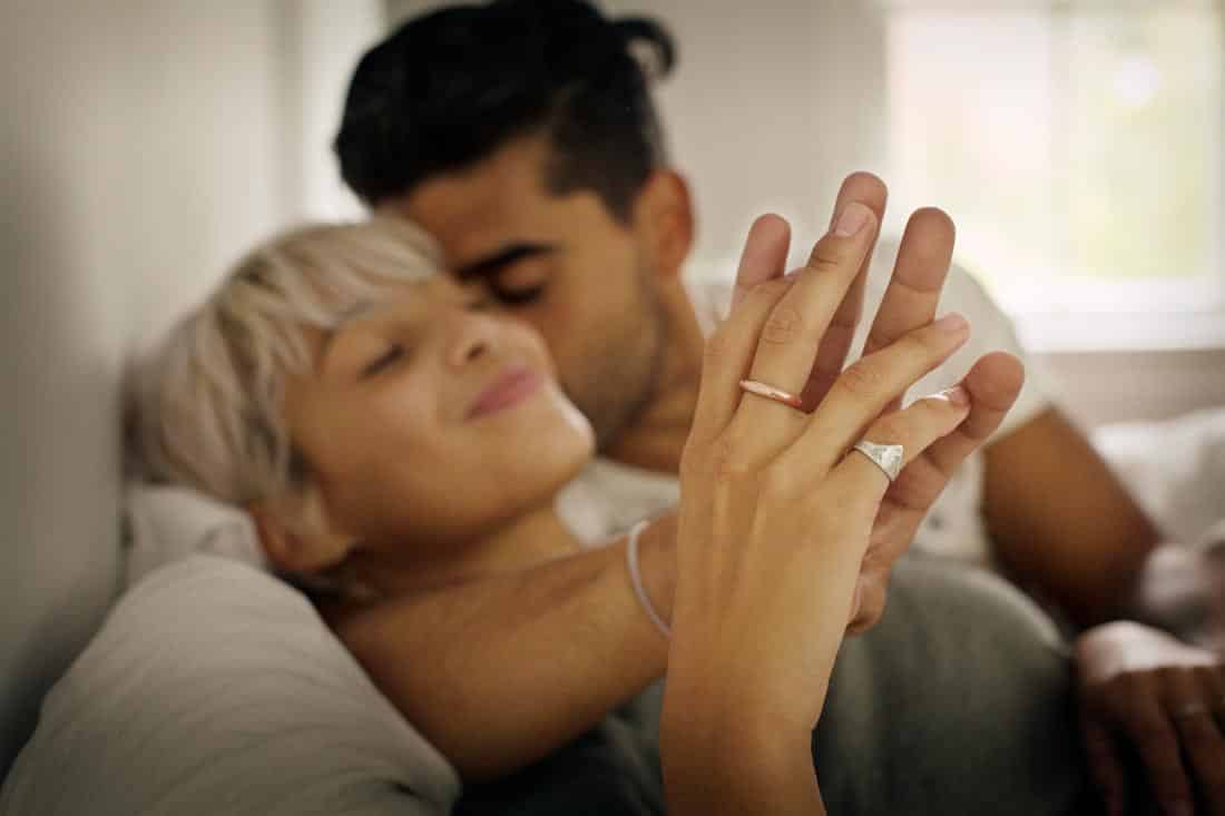 Couple in bed together.