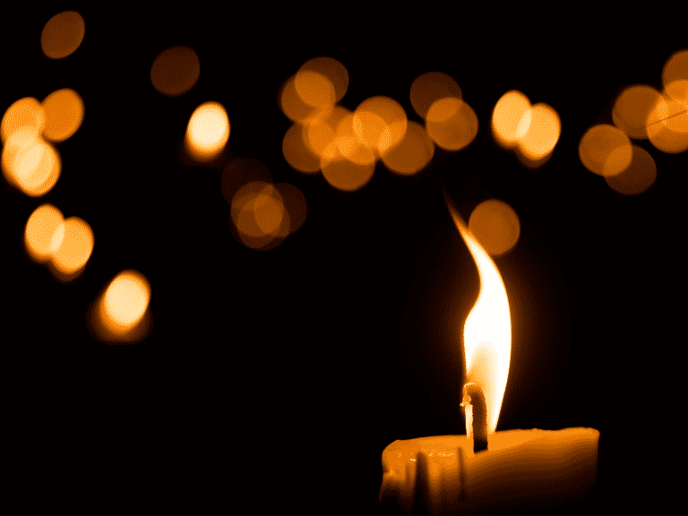 Close up on a lit candle, Fight Racism