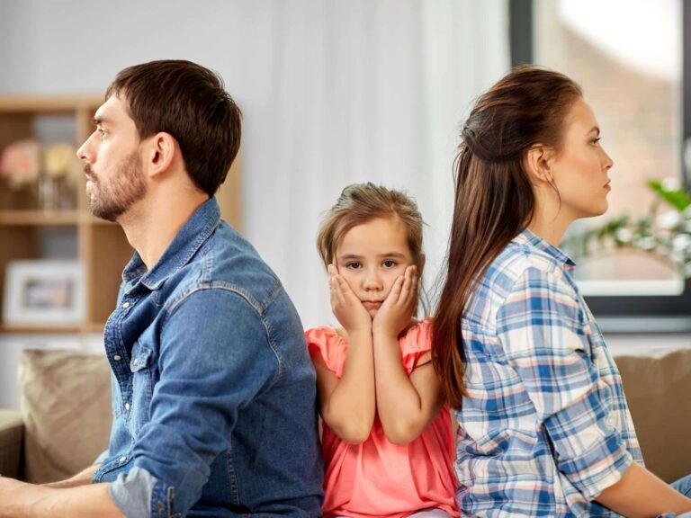 divorcing parents with little girl in the middle
