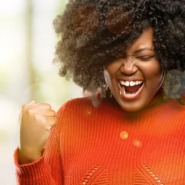 Believing in yourself: Woman feeling confident and excited about an accomplishment.