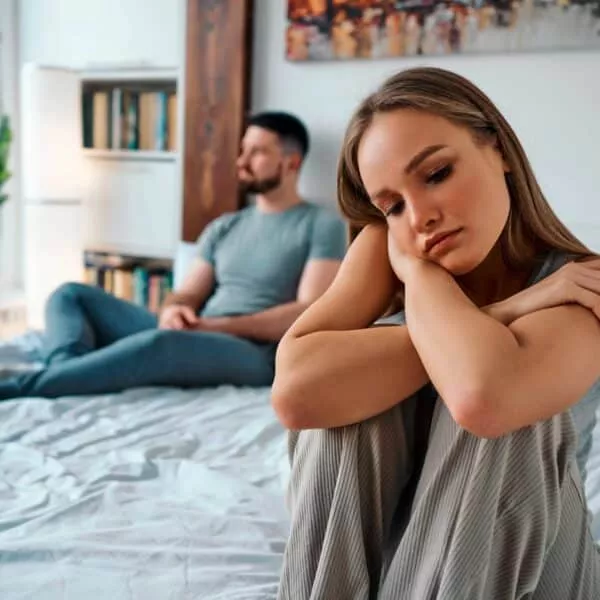 Unhappy couple showing signs your marriage is in trouble.