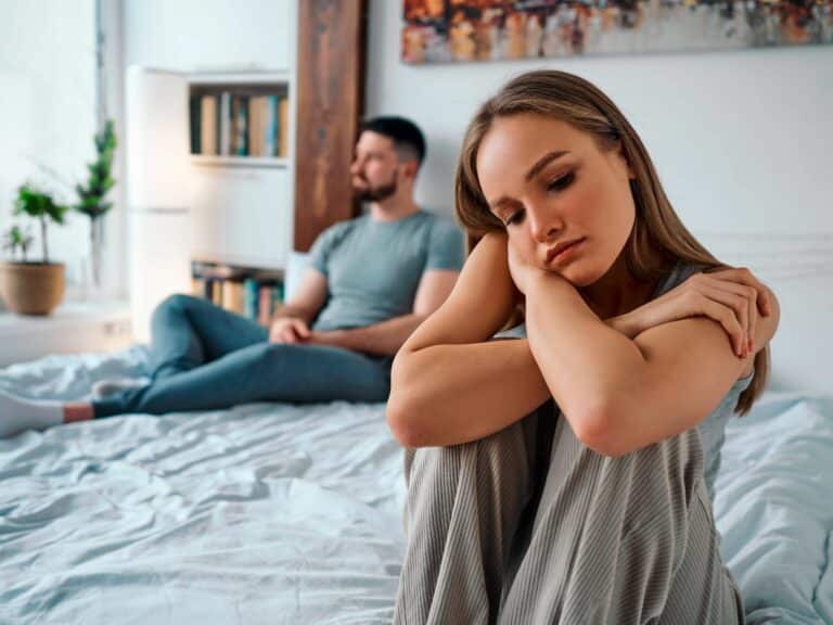 Unhappy couple showing signs your marriage is in trouble.