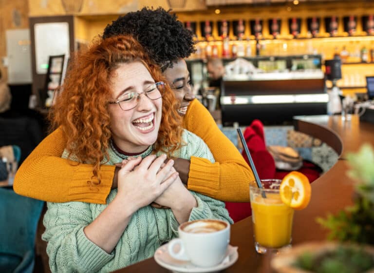 two female friends hugging
