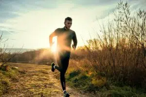 Man jogging representing breakup recovery and how to heal from heartbreak