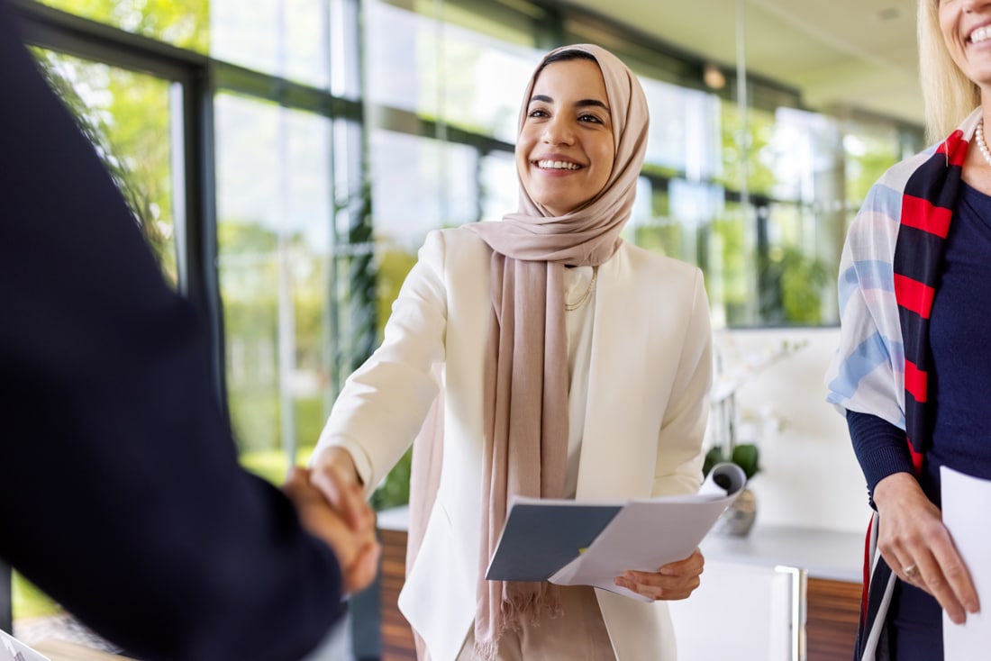 Muslim businesswomen in job interview after resume writing and interview coaching.