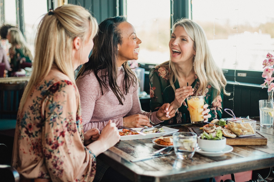 Group of women enjoying brunch after divorce counseling for rebuilding