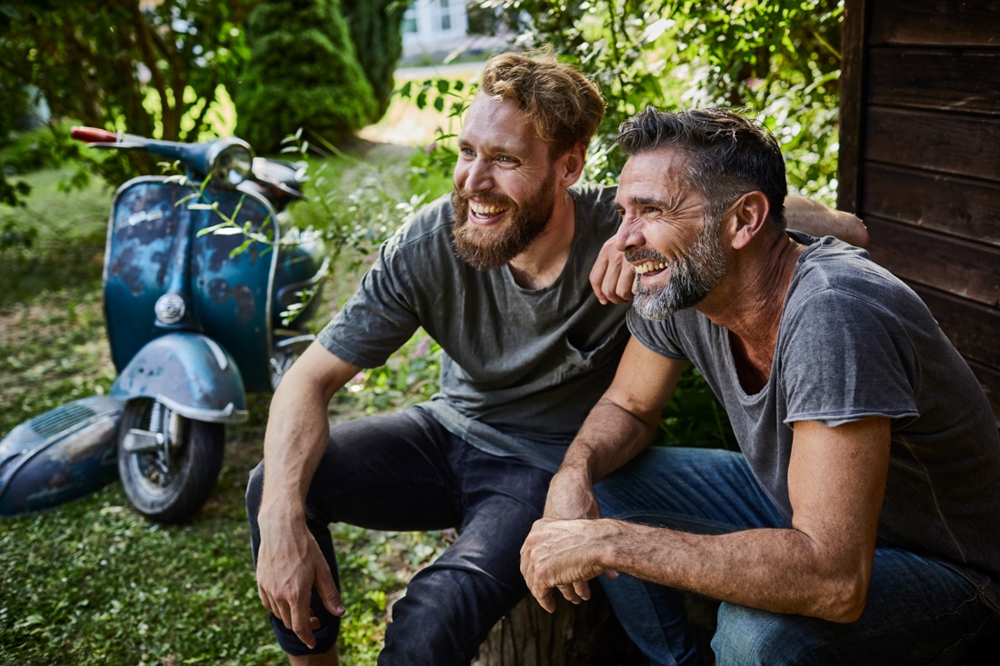 Two male friends outside, representing emotional intelligence coaching success