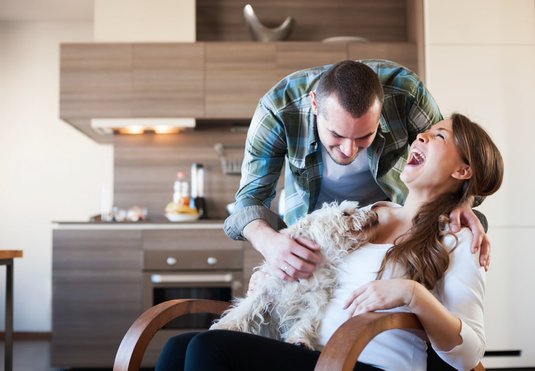 Young couple at home doing premarital counseling online