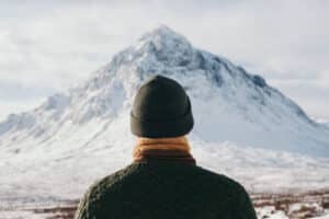 Photo of man looking at mountain, representing career advice for professional growth collection