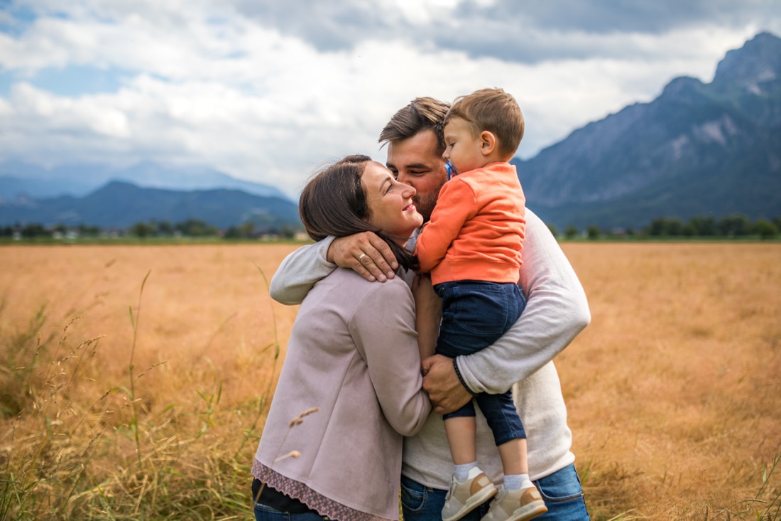 family hugging outside in Colorado, representing couples counseling in Denver