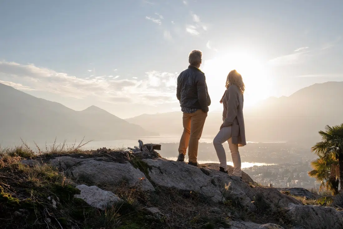 couple standing on mountain top