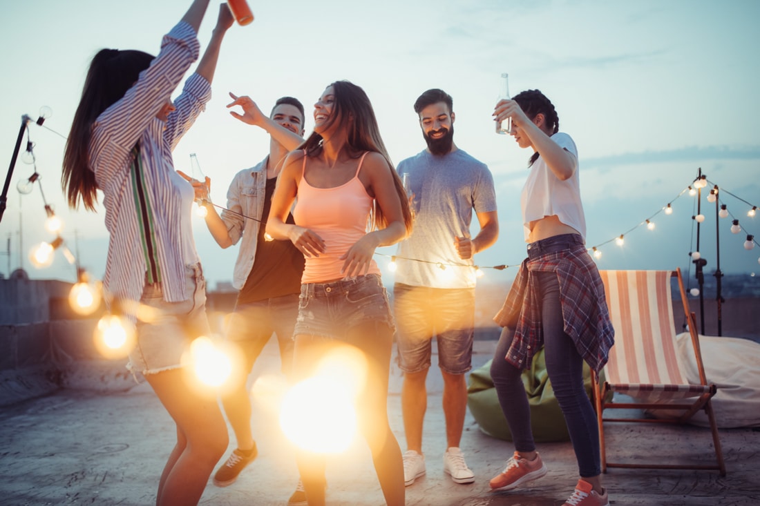 Denver Therapist: Heal Your Heart -Young woman dancing with group of friends