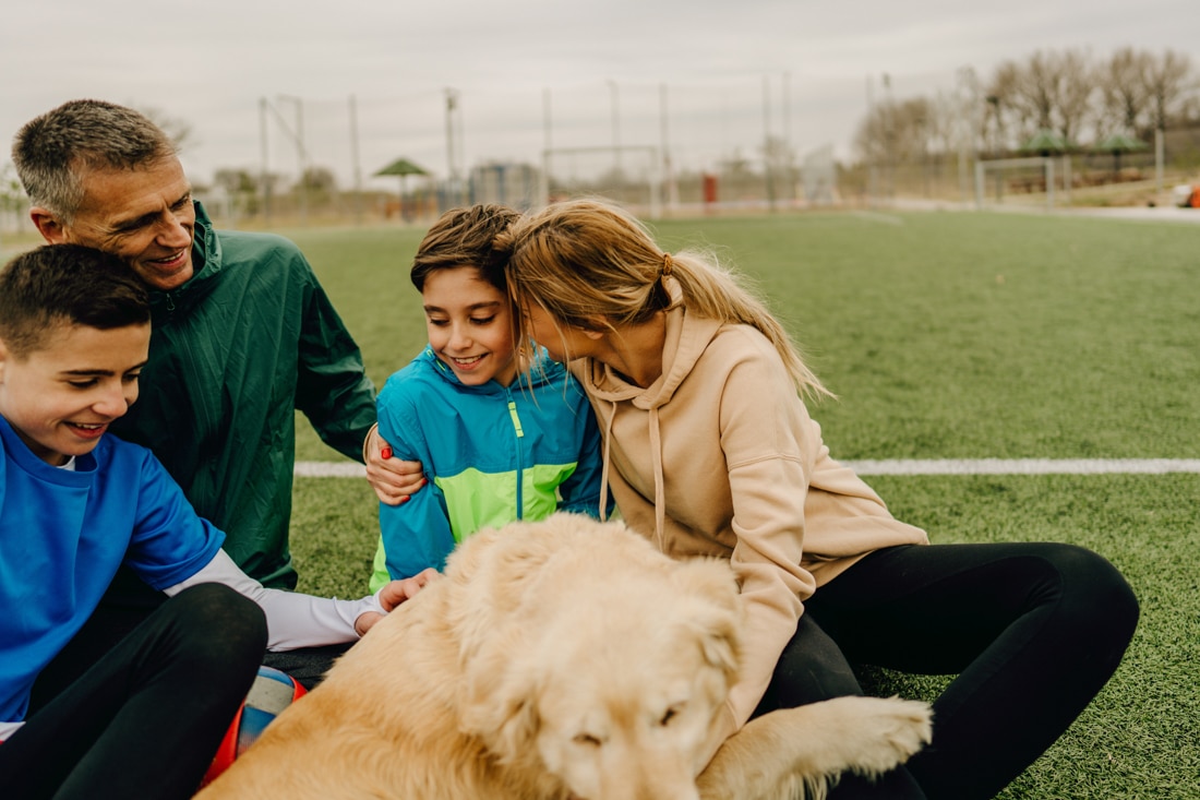 Family on soccer field, represending divorce counseling for coparenting