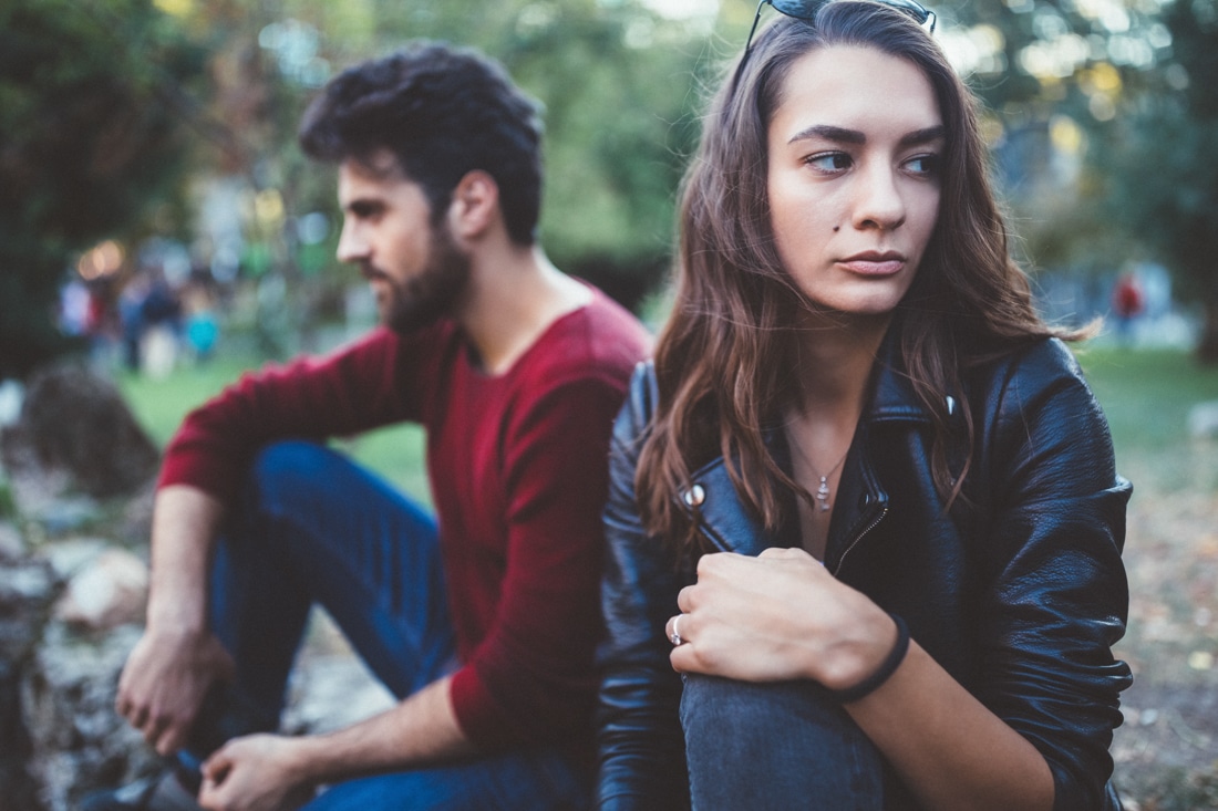 Young unhappy couple feeling distant, representing divorce counseling