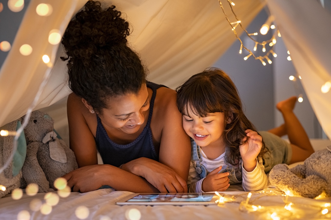 African American Mother and daughter reading together representing divorce counseling for parents