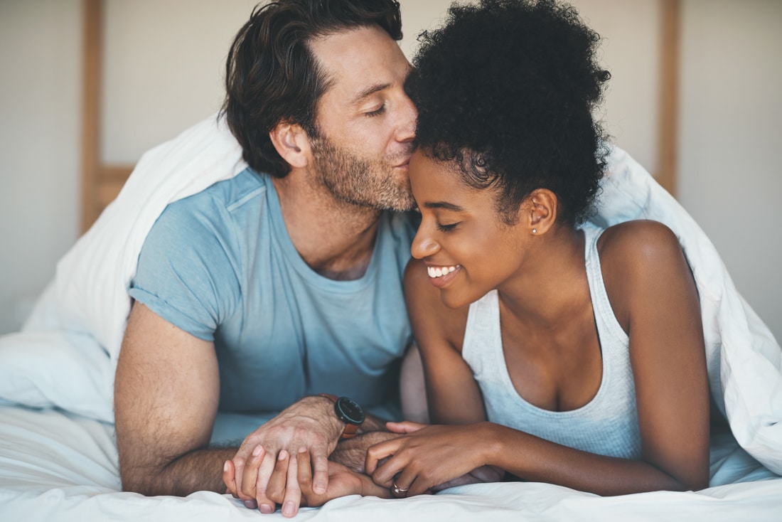 Photo of affectionate couple in pre engagement counseling