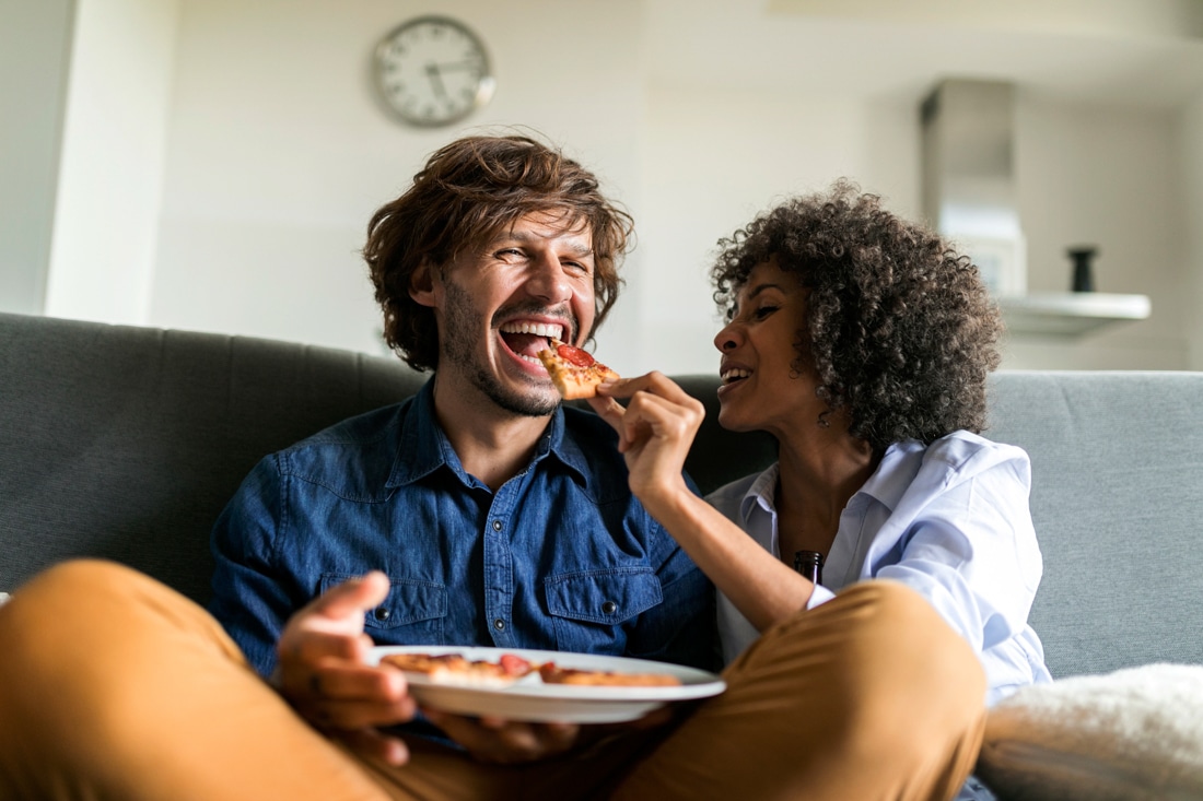 couple feeding each other