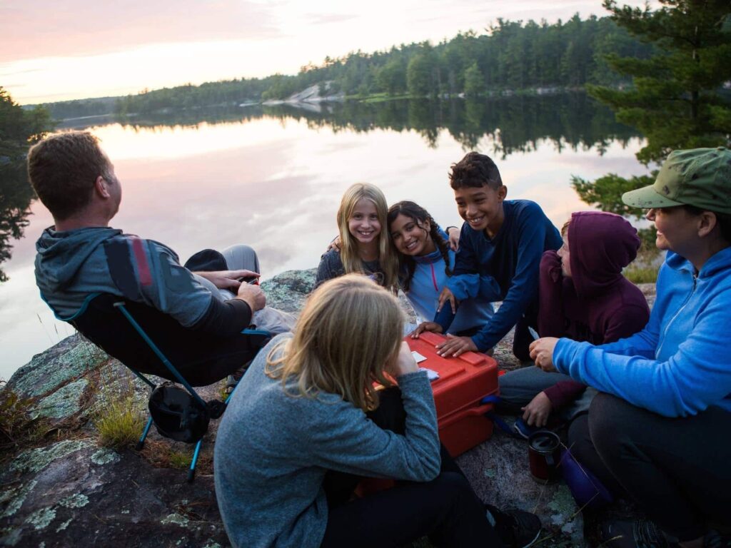 Photo of happy blended family camping, representing dos and don’ts of step-parenting