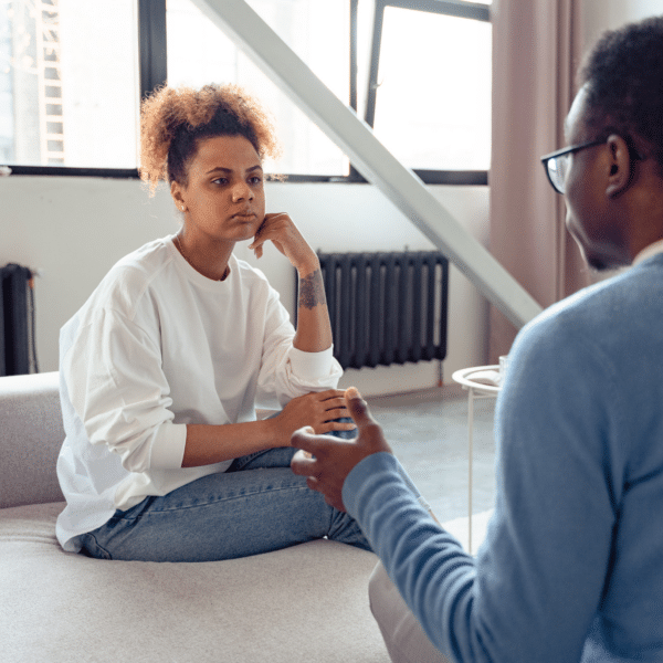 Wife listening to husband representing getting through to your partner.