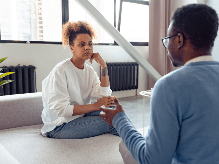 Wife listening to husband representing getting through to your partner.