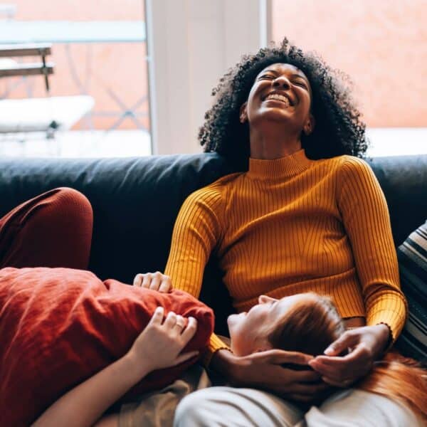 girlfriends laughing on couch: what makes a good life partner?