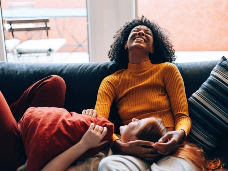 girlfriends laughing on couch: what makes a good life partner?