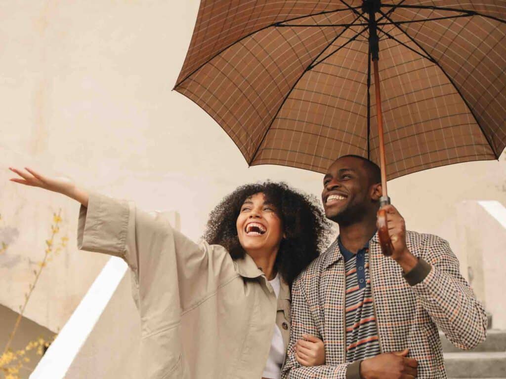 Couple cultivating contentment by making the most of a rainy day