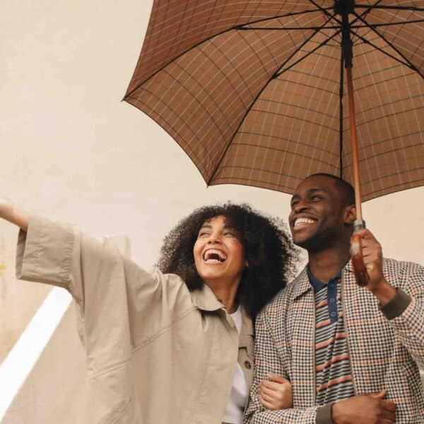 Couple cultivating contentment by making the most of a rainy day