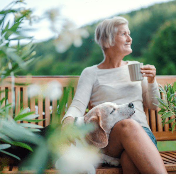 A woman relaxing outside using her senses to be more present