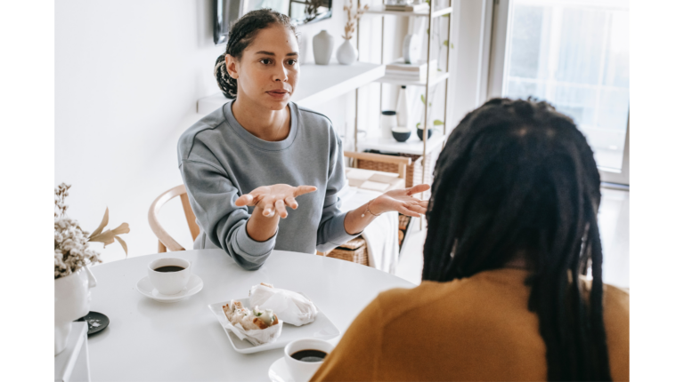 A couple has a heated discussion at a table representing fair fighting rules and how to fight fair in relationships
