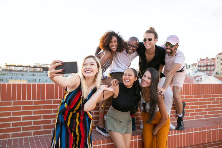 A group of friends pose for a photo representing why your 20s are not your best decade