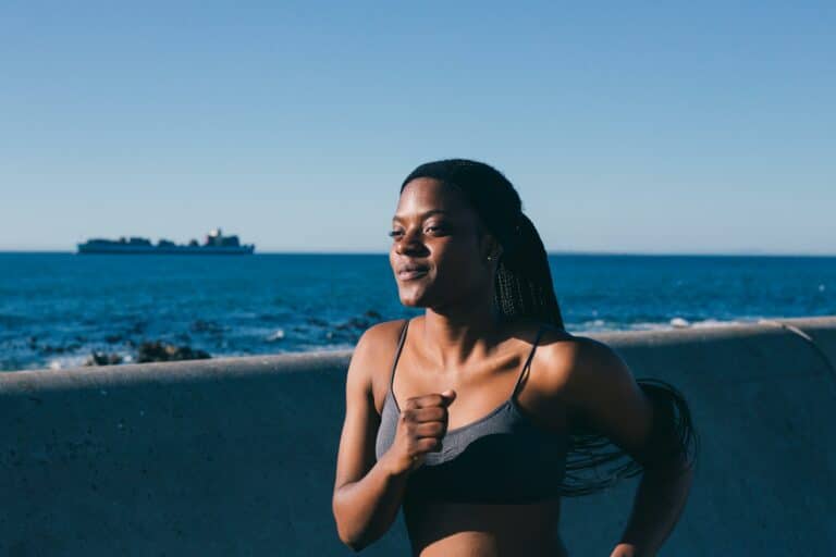 A woman focuses on herself by going for a run representing the benefits of going no contact after a breakup.