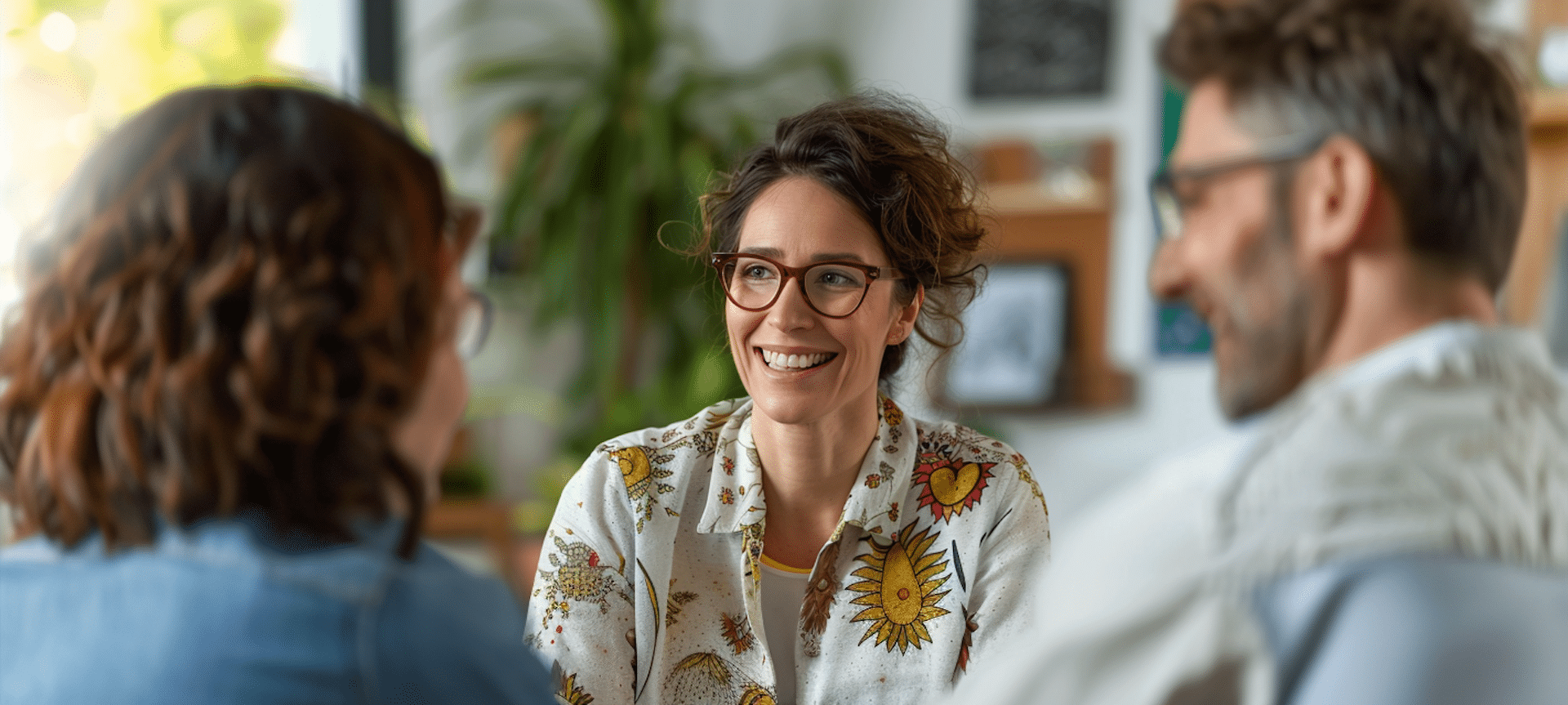 a therapist sits in her office with her new clients representing how to get more therapy clients.