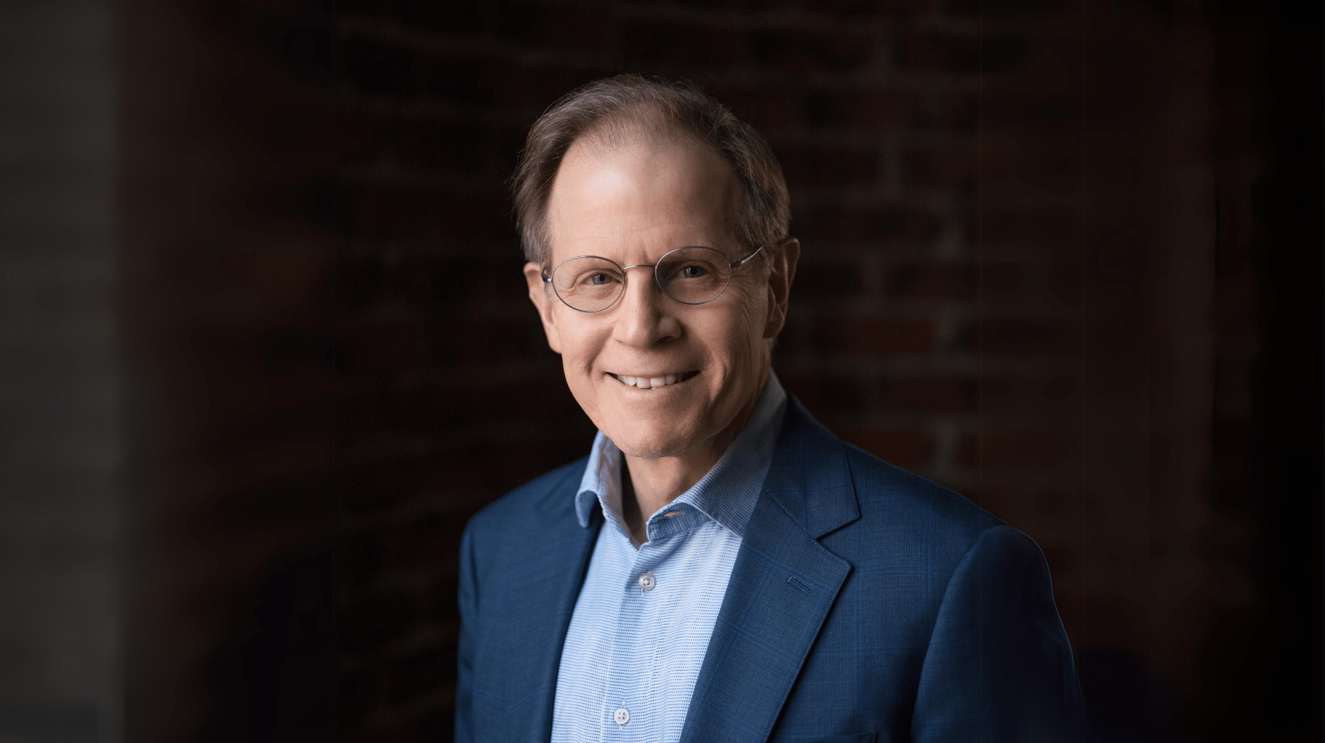 Dr. Dan Siegel's photo represents Attachment Style Therapy with Dr. Dan Siegel and promotes his book The Whole Brain Child.