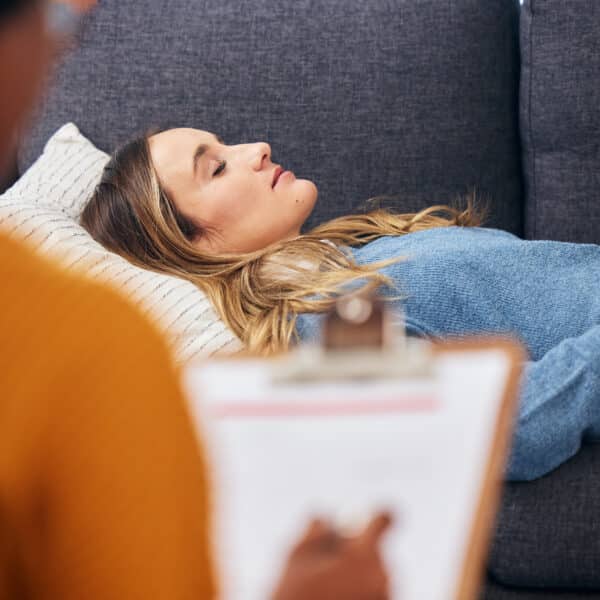 A therapist talks to a woman about her sleep issues representing How Sleep Therapy Can Supercharge Therapy Client Outcomes.