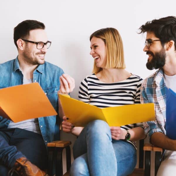 A group of therapists sit together and talk representing Don’t Go It Alone! Therapist Isolation and How to Build Community