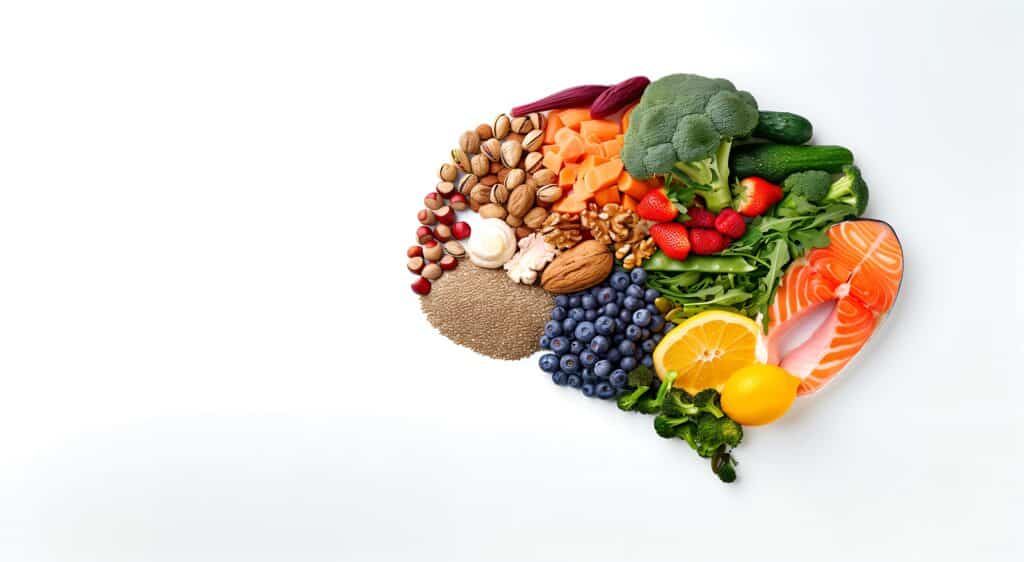 Healthy foods create the shape of a brain representing Beyond the Brain: How Metabolic Psychiatry Is Transforming Mental Health Care.