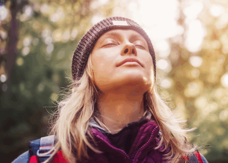 woman enjoying sunshine representing the Healing From Heartbreak Program