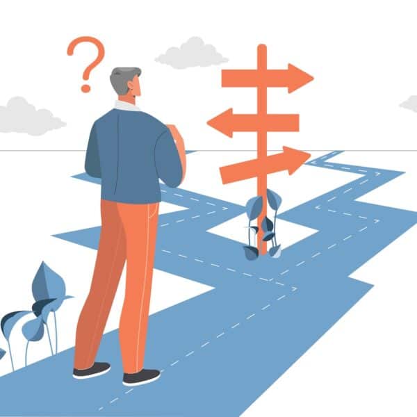 A man standing at a fork in the road representing What Am I Doing With My Life? How to Create a Career Aligned with YOU