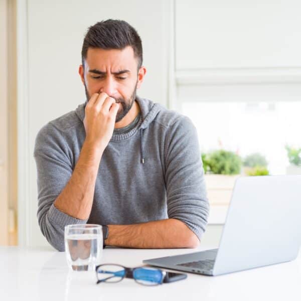 A therapist looks worried and anxious representing “What If I’m Doing It Wrong?” Untangling Therapist Performance Anxiety