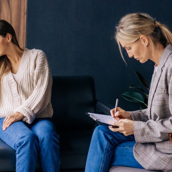 A therapy client sits in her session frustrated that she isn't getting direction or therapist advice representing Do Therapists Give Advice? Finding Direction When Therapy Fails