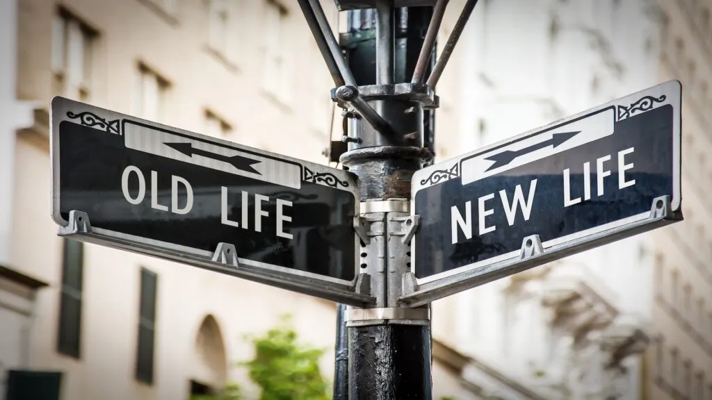 Street sign showing “Old Life” pointing one direction and “New Life” pointing another, symbolizing total life changes and major life transitions.